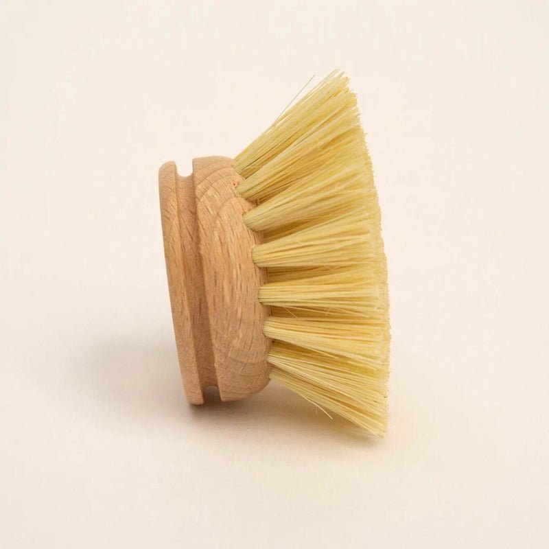 Bamboo cleaning brush for sweeping flour out of the engraved grooves of a rolling pin
